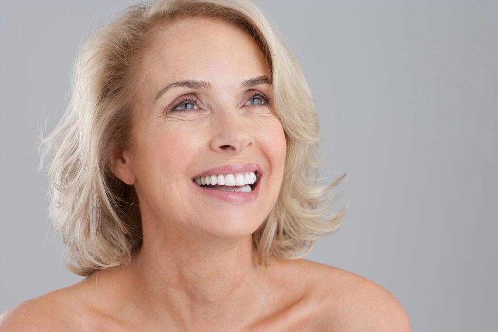 Beautiful senior woman smiling and looking up