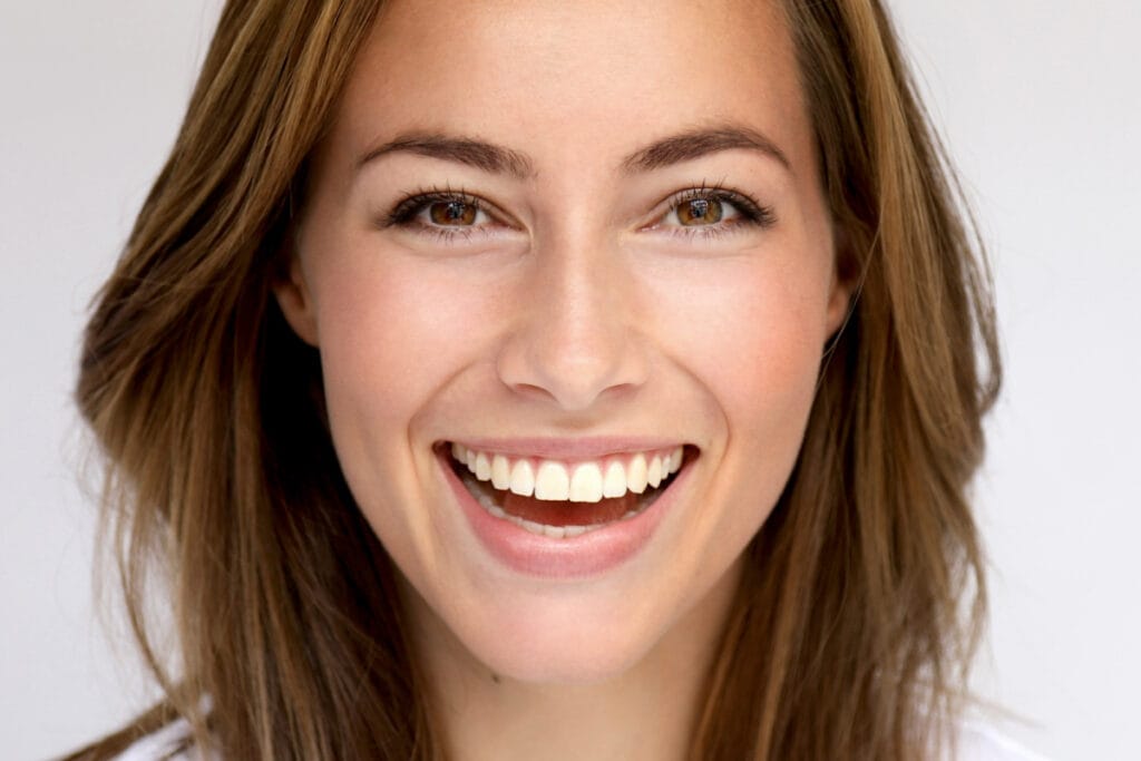 Close up portrait of woman smiling at camera